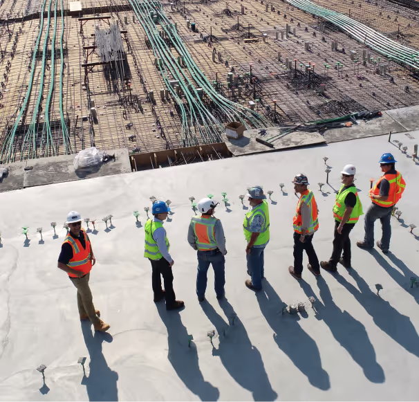 A construction crew standing at a site