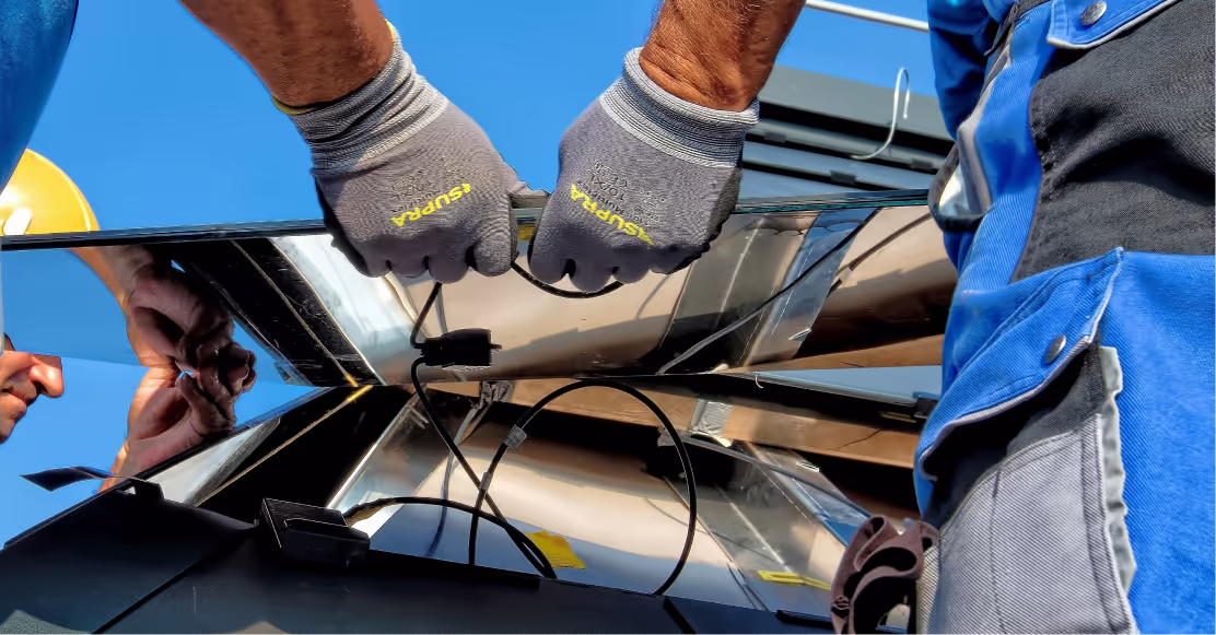 People working with solar panels
