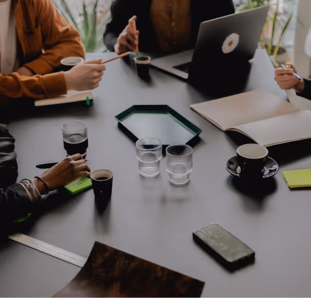 A group of coworkers talking at an in-person gathering