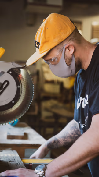 A manufacturer working with his hands