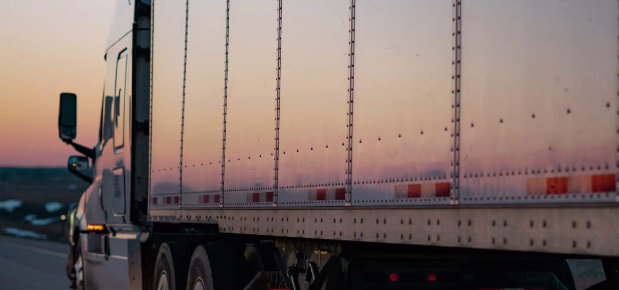 A truck driving down a highway